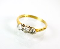 Lot 221 - A three stone graduated diamond ring, the...