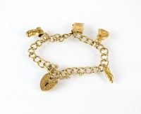 Lot 225 - A 9ct gold curb link charm bracelet, with...