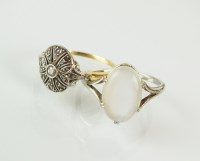 Lot 234 - A cabochon moonstone set ring, the white metal...