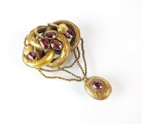 Lot 236 - A 19th century garnet set locket brooch,...