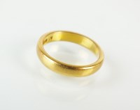 Lot 237 - A 22ct gold plain polished wedding band, ring...