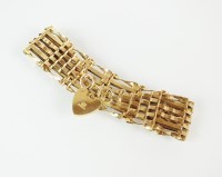 Lot 241 - A 9ct gold six bar gate link bracelet, with...