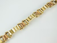 Lot 261 - A yellow and rose metal hollow panel bracelet,...