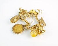 Lot 274 - A yellow metal curb link bracelet, stamped...