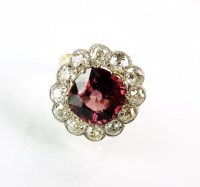 Lot 293 - A red zircon and diamond cluster ring,...