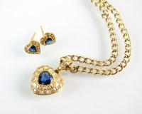 Lot 295 - An 18ct gold sapphire and diamond heart shaped...