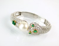 Lot 297 - An emerald, diamond and cultured pearl set...