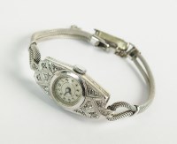 Lot 314 - A Lady's diamond set cocktail watch, the plain...