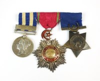 Lot 695 - A group of three medals, awarded to 'Major H....