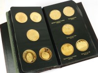 Lot 761 - An album containing fifty silver gilt...