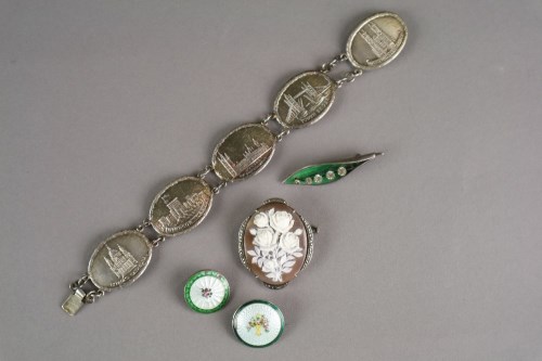 Lot 5 - A silver panel brooch, each oval plaque...