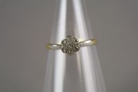 Lot 6 - A diamond floral cluster ring, the yellow...