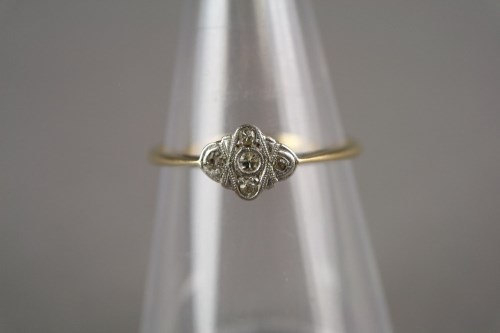Lot 7 - An Art Deco diamond cluster ring, the yellow...