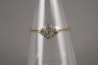 Lot 7 - An Art Deco diamond cluster ring, the yellow...