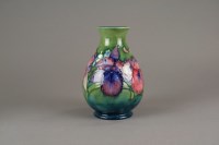 Lot 53 - A Moorcroft vase tube lined with Spring...