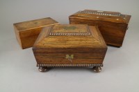 Lot 101 - A late Regency rosewood sarcophagus shape work...