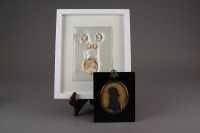 Lot 106 - A framed group of five shell cameos together...