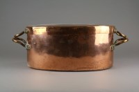 Lot 142 - A copper two handled fish kettle and cover,...