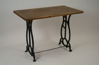 Lot 234 - A pine conservatory table on cast iron open...