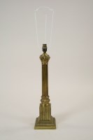 Lot 266 - A gilt metal ionic column table lamp on...