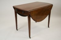 Lot 284 - A George III mahogany Pembroke table, the oval...