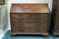 Lot 291 - A George III mahogany bureau, the crossbanded...