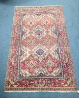 Lot 299 - A Persian silk rug the field centred by indigo...