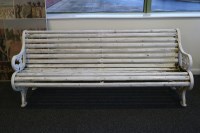 Lot 303 - A roll back cast iron and painted wood slat...