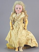 Lot 114 - A Simon and Halbig bisque head doll, wearing a...