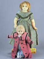 Lot 115 - A Victorian poured wax doll, wearing short...