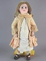 Lot 116 - A large French bisque headed doll, perhaps...