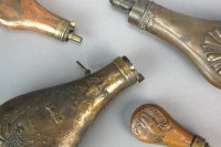 Lot 236 - A group of powder flasks to include an...