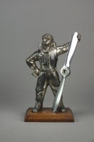 Lot 256 - A silver-plated table lighter in the form of...