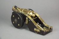 Lot 265 - A brass bound desk cannon mounted on wooden...