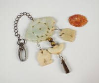 Lot 80 - A Chinese jade pendant on chain and a further...