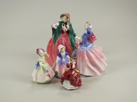 Lot 102 - Twelve Royal Doulton figures to include: Lady...