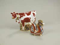Lot 133 - A Royal Crown Derby paperweight of a Daisy Cow,...