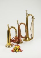 Lot 168 - A copper and brass bugle, 27cm long, a brass...