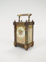 Lot 210 - An Edwardian gilt metal carriage timepiece in...