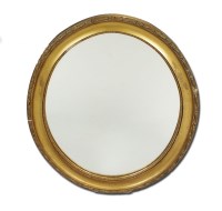 Lot 216 - An oval gilt gesso wall mirror, 60cm wide and...