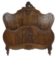 Lot 218 - A French Louis XV style walnut bed frame with...