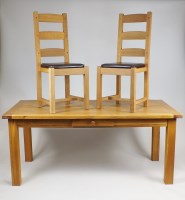 Lot 229 - A light oak dining room dining room table and...
