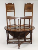 Lot 233 - A cabinet made Cromwellian style oak dining...