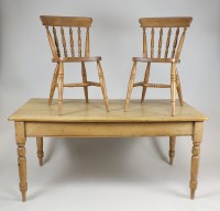 Lot 236 - A pine kitchen table the rectangular top above...