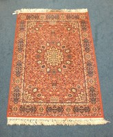 Lot 268 - A Keshan machine made wool rug with central...