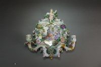 Lot 115 - A pair of Continental porcelain candelabra...