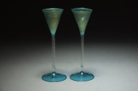Lot 123 - A pair of small green liqueur glasses flecked...