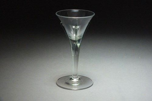 Lot 124 - A single wine glass with trailed green...