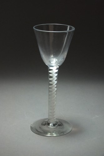 Lot 136 - An 18th century wine glass with air twist stem,...