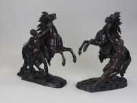 Lot 150 - A pair of bronze patinated spelter Marly horse...